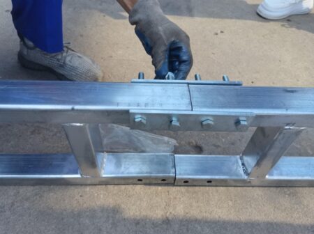 double base rail system being bolted together with a 4 bolt plate on both sides. container mounted shelter assembly