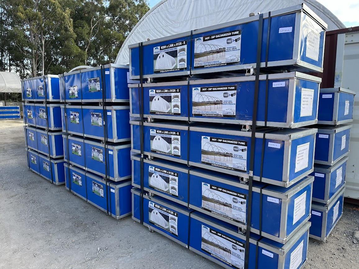 shipping container dome crates stacked, ready for delivery. Quality Domes Direct.