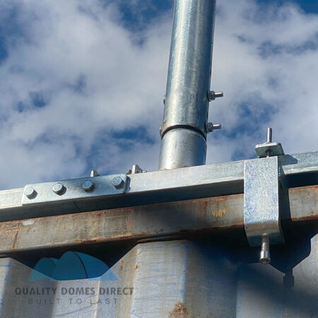 Looking up at a typical base rail connection with C Clamp locking component securing the base rail to the top of the container